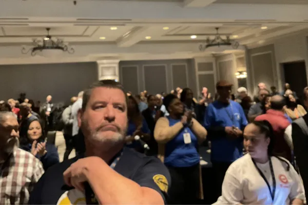 union members standing in hotel ballroom preparing for the first day of the texas cope convention 2024