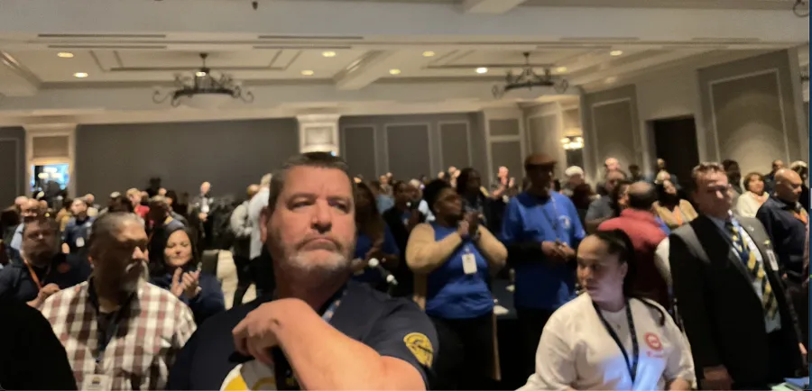 union members standing in hotel ballroom preparing for the first day of the texas cope convention 2024